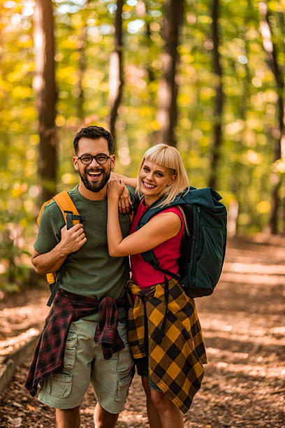 istock Happy couple walking together in a forest. 2237843830