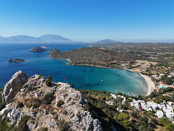istock Aerial view of Datca with a serene bay, cliffs, and a blue sea under a bright sky. Turkey. 2237843859