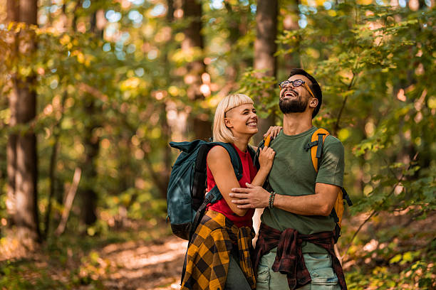 istock Happy couple walking together in a forest. 2237846112