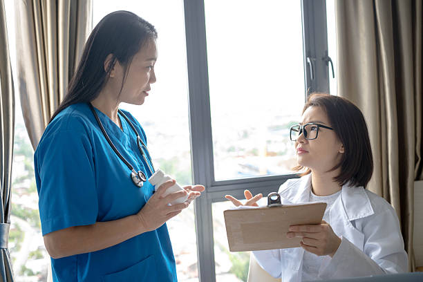istock Professional Support: Doctors Clarifying Health Report 2237846171