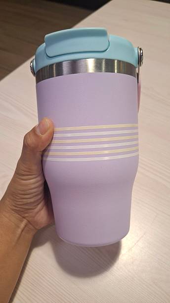 istock Stylish reusable tumbler with pastel design placed indoors under warm lighting. 2237846463