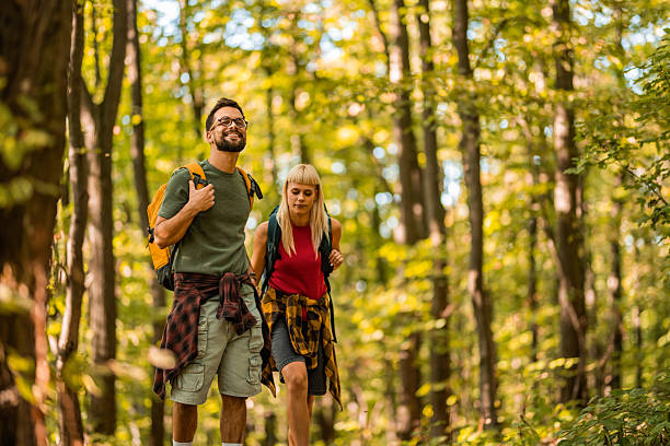 istock Happy couple walking together in a forest. 2237846591