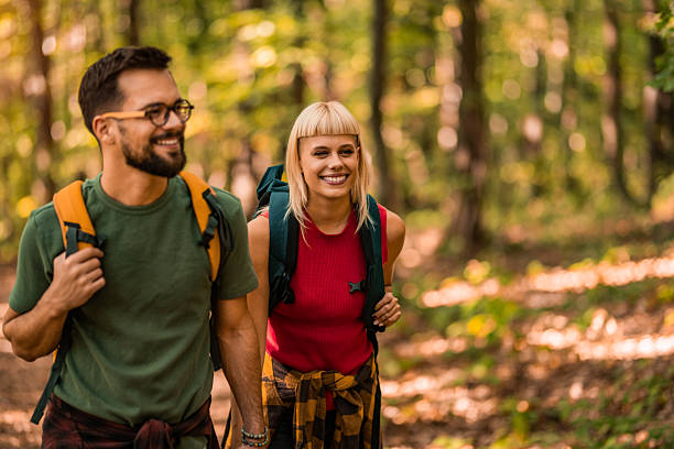 istock Happy couple walking together in a forest. 2237846726