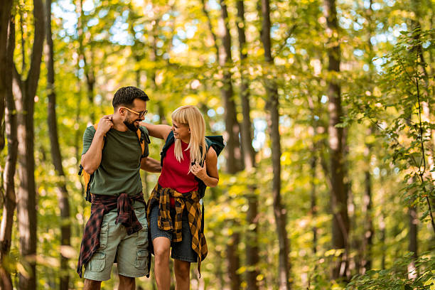 istock Happy couple walking together in a forest. 2237846749