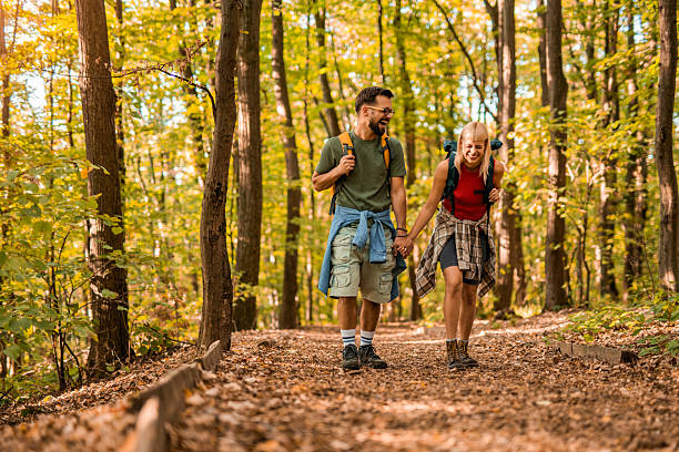 istock Happy couple walking together in a forest. 2237846907