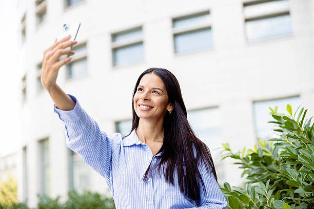 istock Woman Taking Selfie Outdoors With Smile 2237847090
