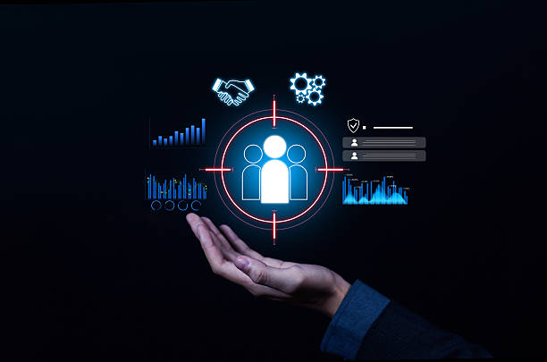 istock Business hand holding digital target audience icon with data charts, analytics, and strategy symbols, representing customer focus, marketing, segmentation, business growth, and audience engagement. 2237847577