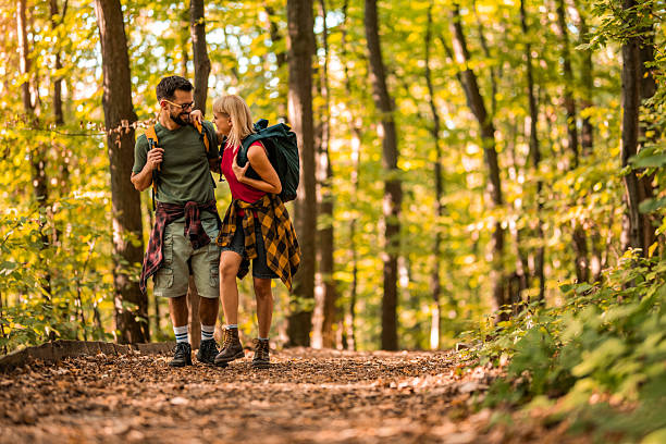 istock Happy couple walking together in a forest. 2237847605
