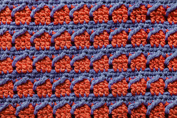 Orange blue seamless knitted texture. Volumetric crochet striped pattern. Knitted background.