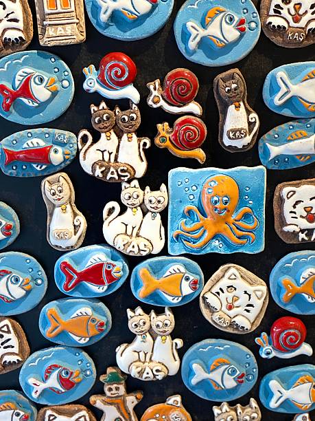 Colorful animal themed magnets displayed on a black surface background