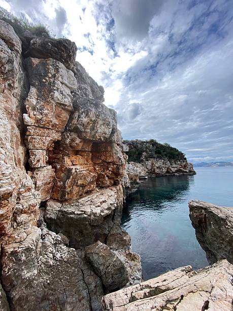 istock Rocky coastline landscape with dramatic cliffs under cloudy sky, suitable for natural backgrounds 2237848511