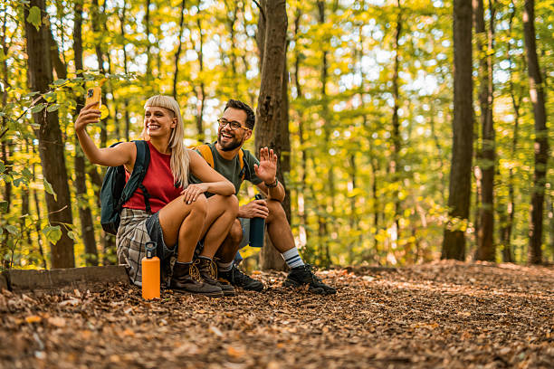 istock Happy couple having fun while hiking together in a forest. 2237848539