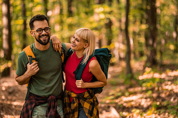 istock Happy couple walking together in a forest. 2237848765
