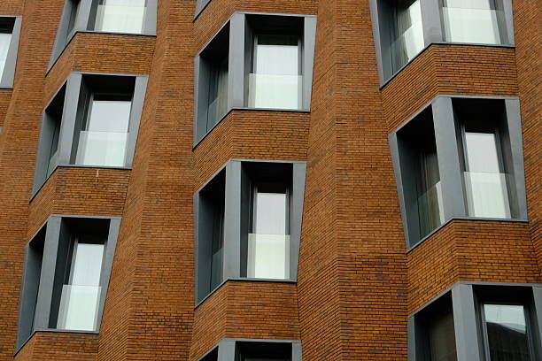 Building windows on the brick house walls, architecture, building exterior