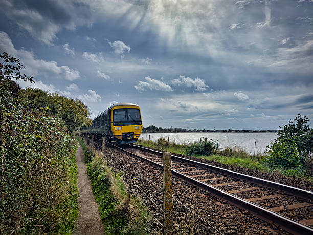 istock Train travelling on the Exmouth line in Devon 2237855349