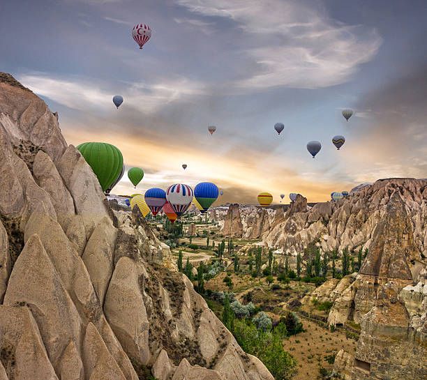 Sunset rock mountain scenery with hot air balloons, Cappadocia, Turkey
