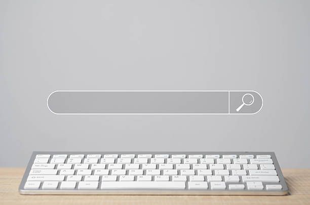 istock A wireless keyboard on a desk with a digital search bar floating above, symbolizing online search and internet browsing. 2237866810