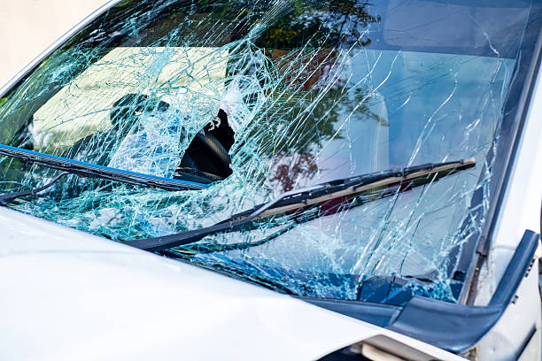 istock Broken car windshield with severe cracks and shattered glass after accident, close-up view of damaged vehicle window. Concept of crash, insurance, danger, repair, safety, and transportation problem. 2237867558
