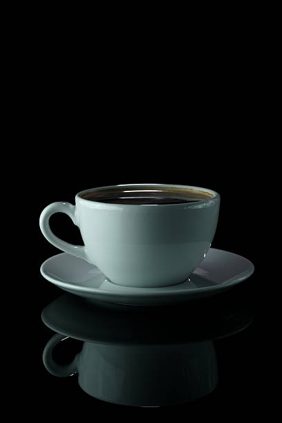 istock Black coffee in white cup on dark reflective background 2237868440