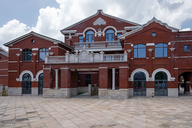 istock The Facade of a Red Brick Building with Arched Windows and Balconies 2237868698