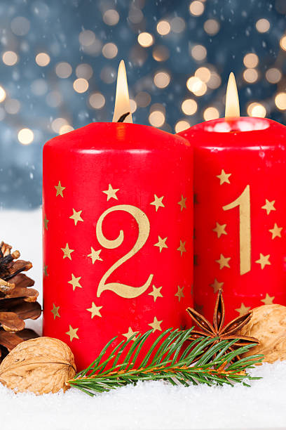 istock Second 2nd Sunday in advent with burning candle Christmas time winter with copyspace copy space portrait format 2237871142
