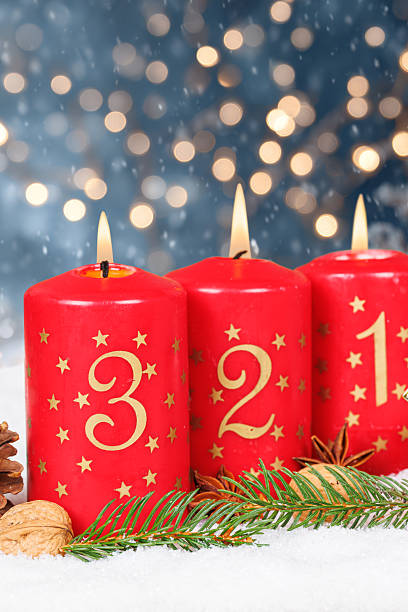 istock Third 3rd Sunday in advent with burning candle Christmas time winter with copyspace copy space portrait format 2237871198