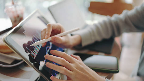 Asia businessmen consulting using digital tablet fintech and visual applied AI machine learning next generation technology conceptual abstract to making sale in business