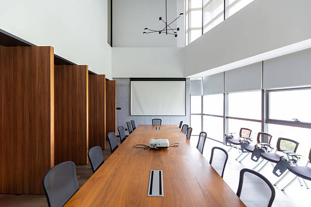 istock Modern Conference Room with Long Wooden Table and Comfortable Seating Arrangement 2237874142