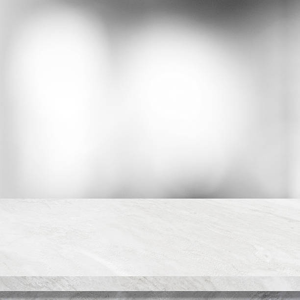 istock Empty white table top, counter, desk background over blur abstract bokeh light background, White marble stone table, shelf and blurred white backgroundt for food, product display mockup, template 2237884606