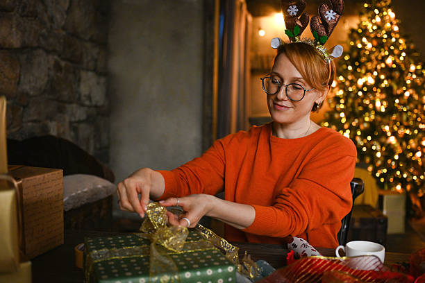 istock Woman wrapping Christmas presents 2237886535