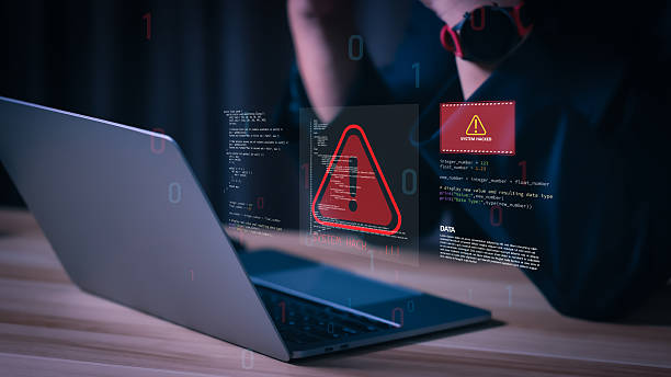 istock Cybersecurity concept showing hacker attack on laptop with warning alert symbols and system hacked notification, illustrating data breach, malware threat, and online security risk. 2237887693