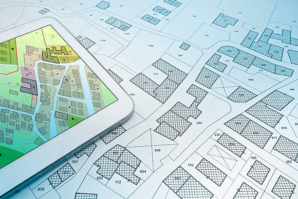 istock FICTIONAL CADASTRAL MAP ON DIGITAL TABLET - Building activity and construction industry with General Urban Plan 2237887797