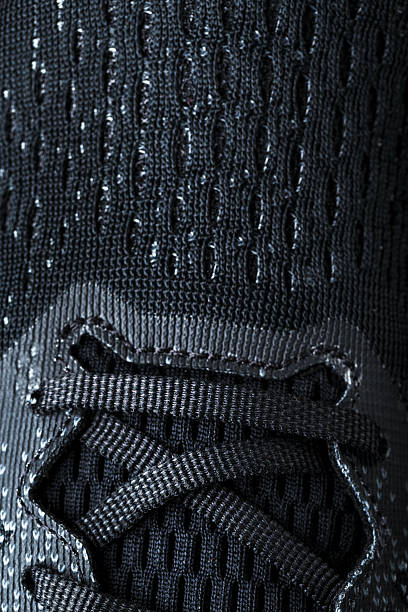 istock Mesh of black sports sneakers for training Macro 2237890228