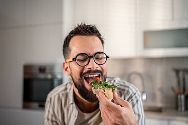 istock Man enjoying healthy snack in kitchen 2237890592