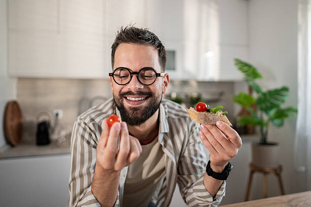 istock Happy man enjoying healthy bruschetta and cherry tomatoes 2237890623