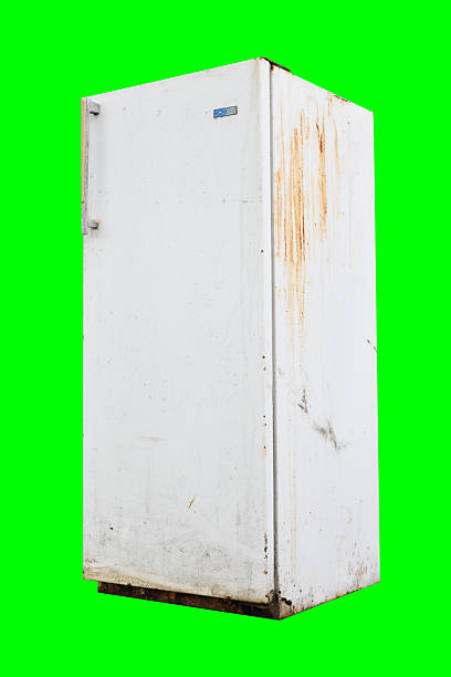 istock Old rusty refrigerator with faded paint and stains on the surface, isolated on green background. 2237890768