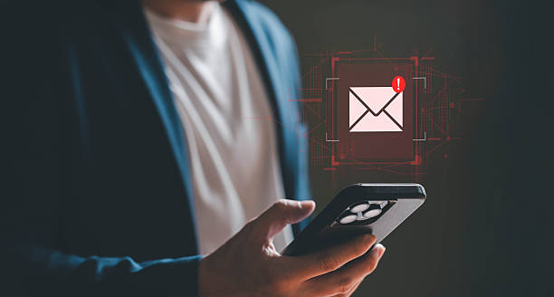istock Business man using smartphone and computer that show warning sign after got attack phishing email by malware from hacker that commit cyber crime or software crash to cause an error. 2237895816
