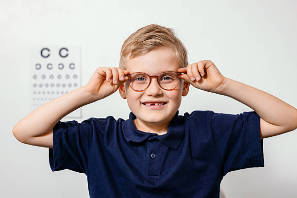 istock smiling child with optical eyeglasses during eye examination 2237896350