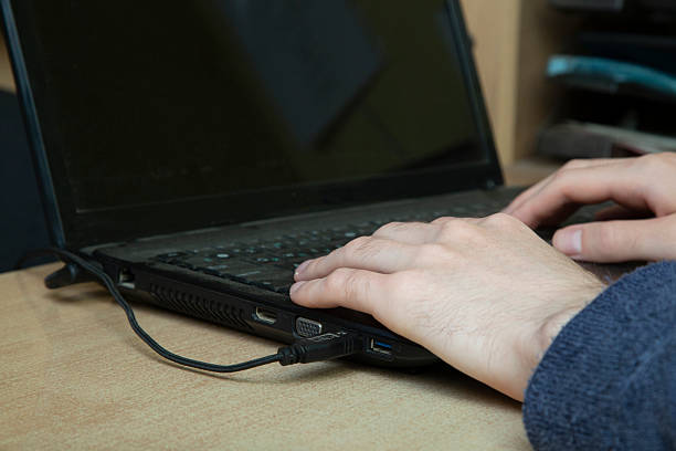 istock A man is working on a laptop. His hands are on the keyboard. 2237897673