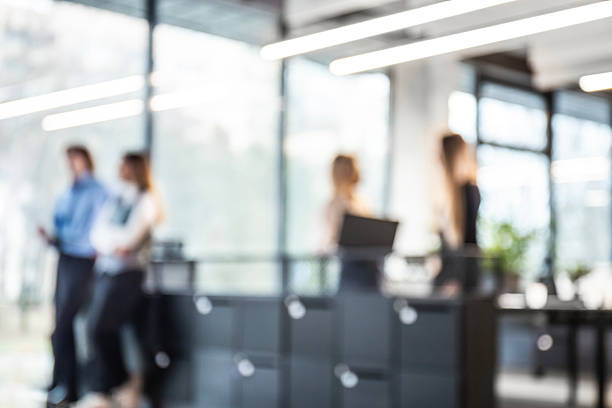 istock Blurred image of business people standing in the office 2237905099
