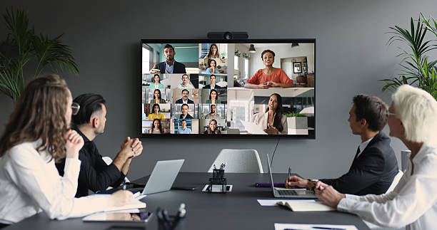 istock Group of multinational businesspeople, displayed on screen, engaged in videocall 2237906896