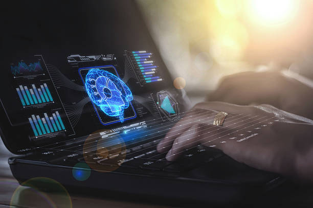 istock A network graph connected to a hologram of a brain, surrounded by glowing blue lines, floats on the screen of a computer that a businesswoman is using, powered by artificial intelligence technology. 2237908628