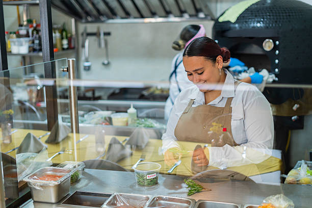 istock Restaurant owner gets ready to open the doors and start serving customers 2237914111