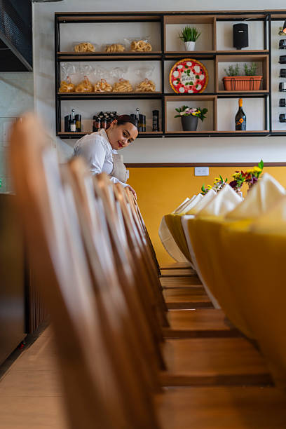 istock Restaurant owner gets ready to open the doors and start serving customers 2237914170