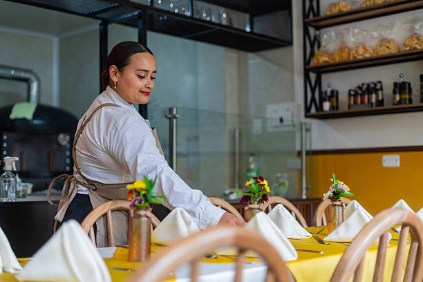 istock Restaurant owner gets ready to open the doors and start serving customers 2237914304