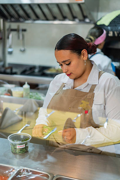 istock Restaurant owner gets ready to open the doors and start serving customers 2237914331