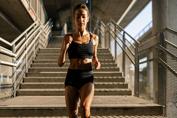 istock Young woman running in urban area 2237919295