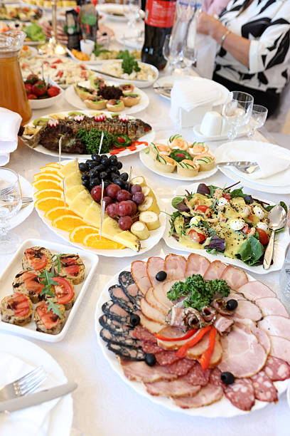 istock Festive table with meat dishes, vegetables, fruits and drinks. 2237921107
