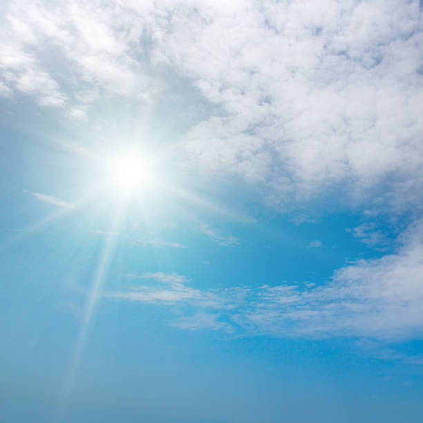 istock Blue sky with bright sun and beautiful clouds 2237925297
