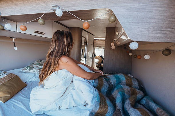 istock Woman Relaxing in Cozy Camper Bed Morning 2237926965